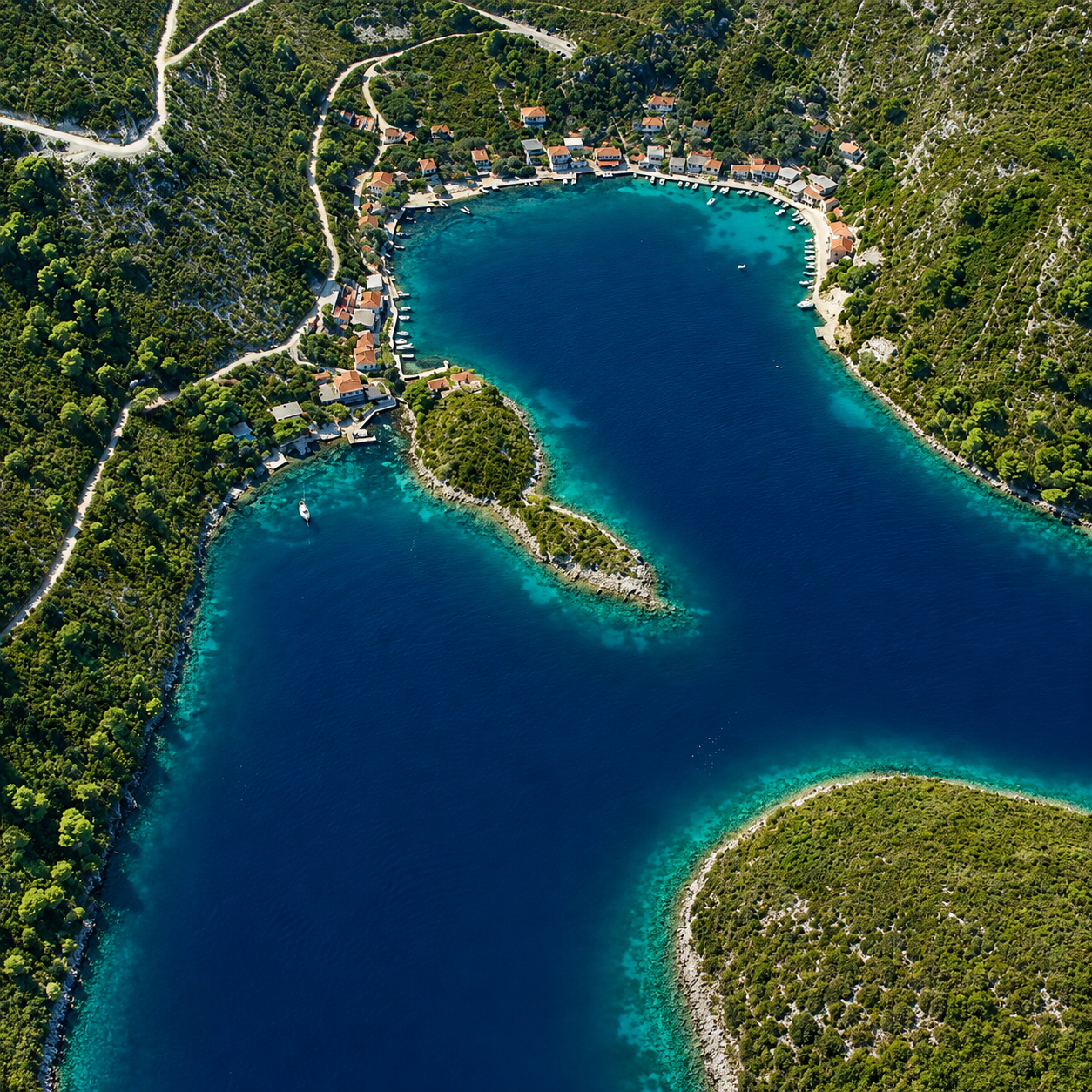 Aerial of the village and turquoise water